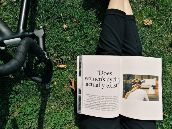 gloria ciceri women cycling reading a magazine