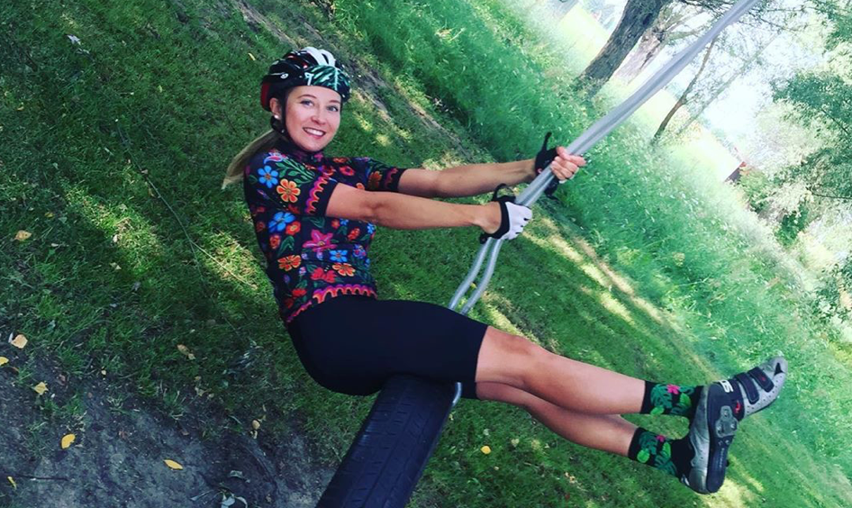 woman cycling with helmet in Poland