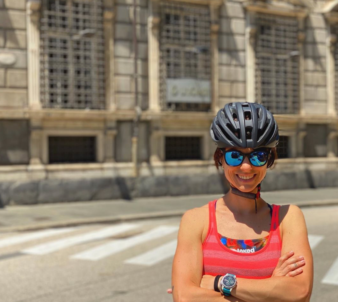 woman cycling with a helmet