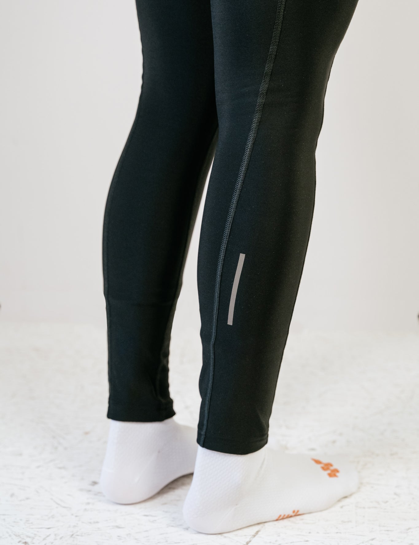 Cuissard long d'hiver Amélia noir vue de profil montrant les bandes réflectives en bas de jambes