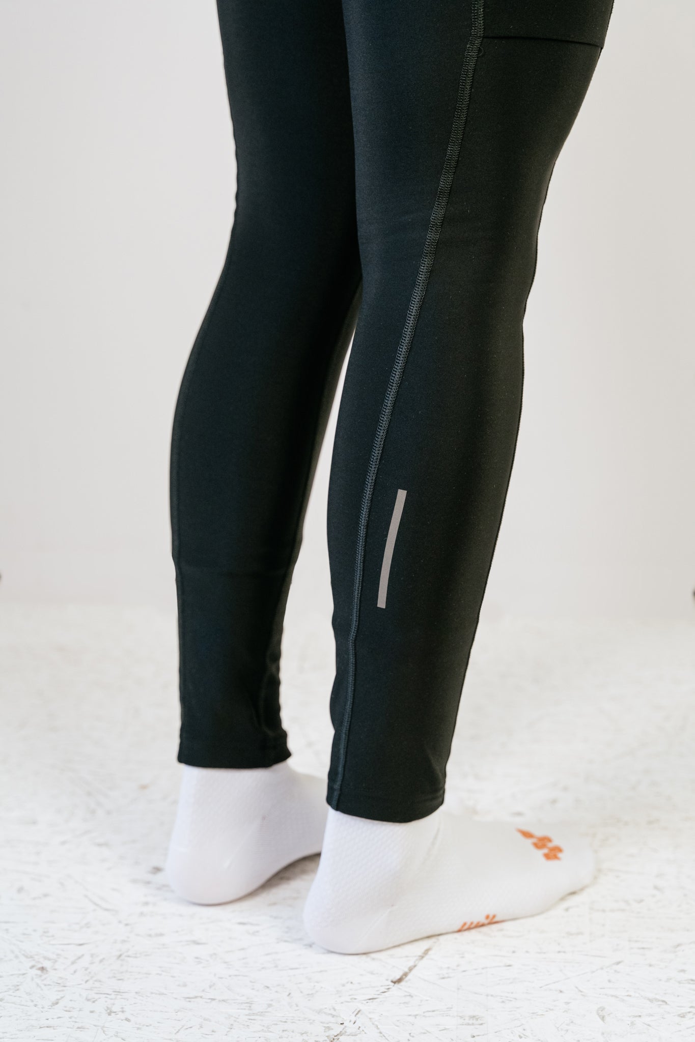 Cuissard long d'hiver Amélia noir vue de profil montrant les bandes réflectives en bas de jambes